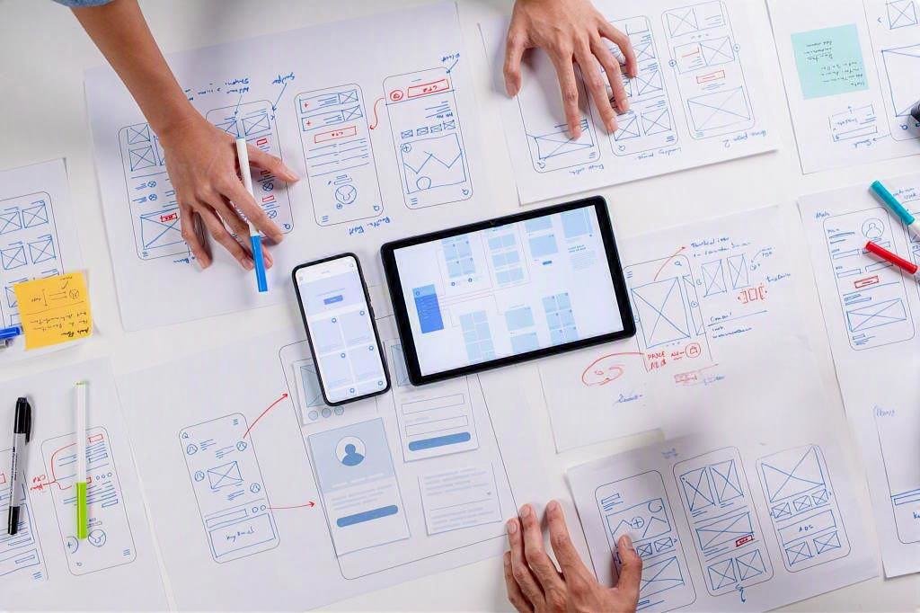 Secure web application development team working on code and UI design